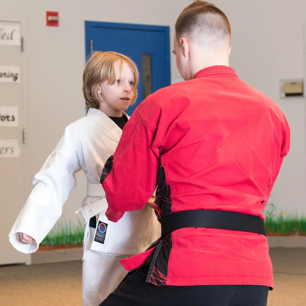 Karate student receiving belt
